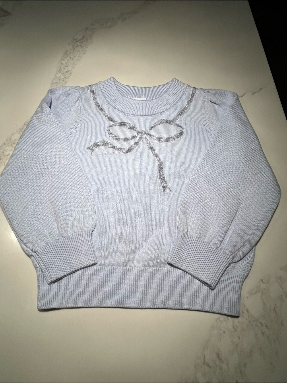 NWT gap gorgeous light blue sweater w/silver glittery bow sweater.  Size 2 years